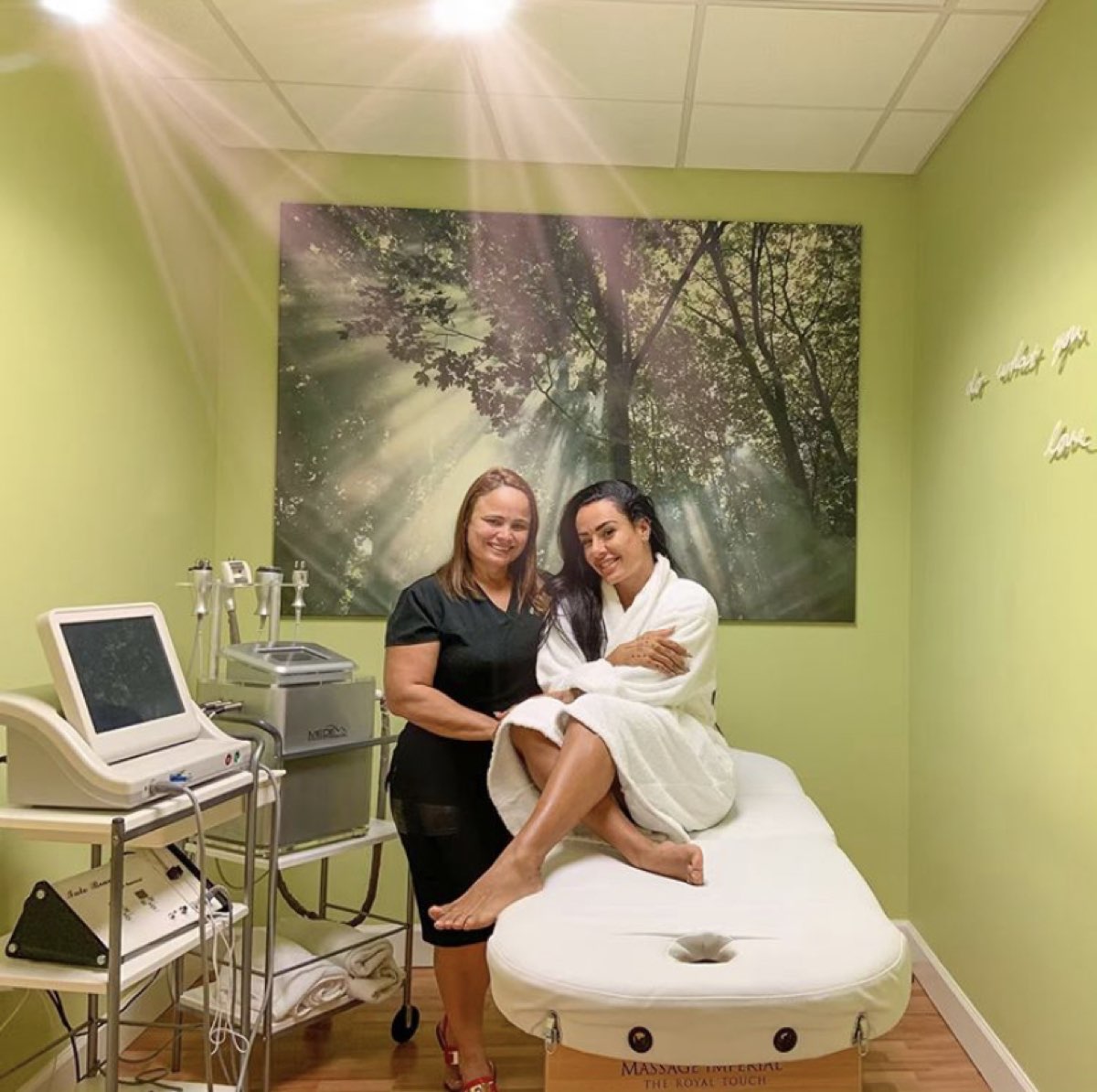 Andrea Oliveira with a client in the Touch Massage treatment room