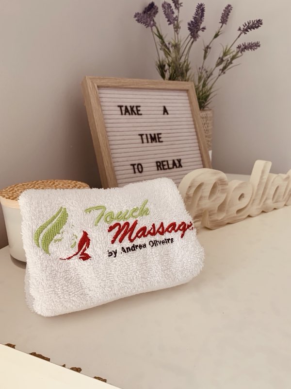 A 'take a time to relax' sign with lavender and a Touch Massage towel